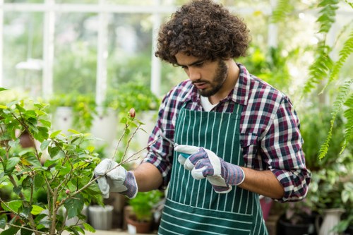 Gardener carrying out safe maintenance work in a garden