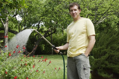 Final tidy-up after garden clearance in Grange Park