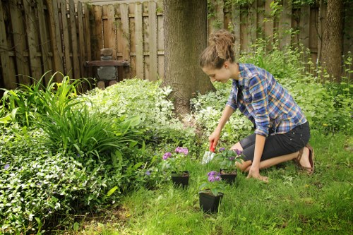 Local gardeners in Grange Park shaping a neat outdoor space